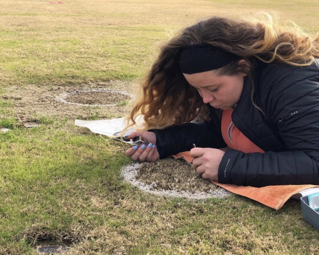 Member Dallas Taylor lays counting turf tillers to inform a research study