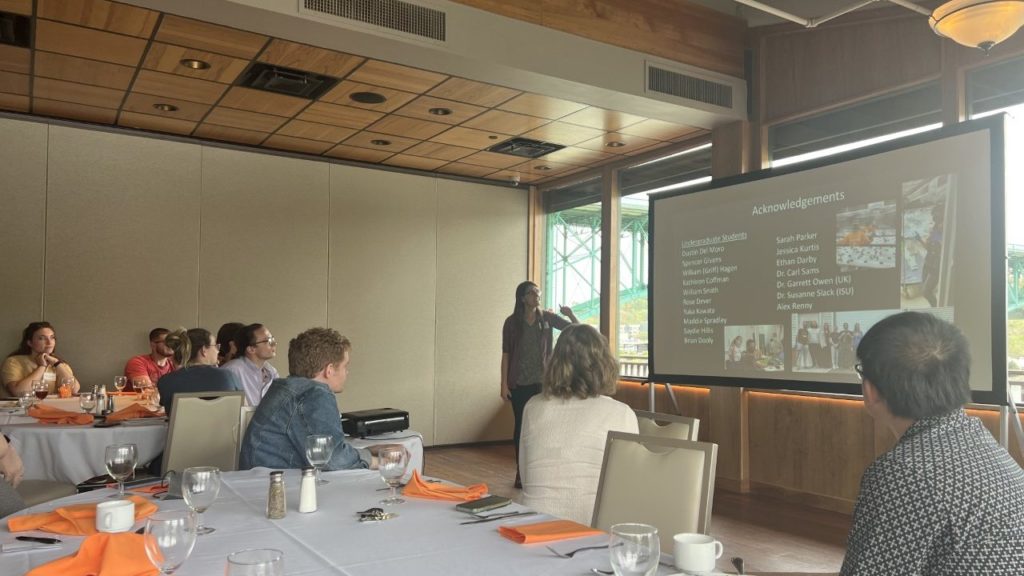 People watching a woman present
