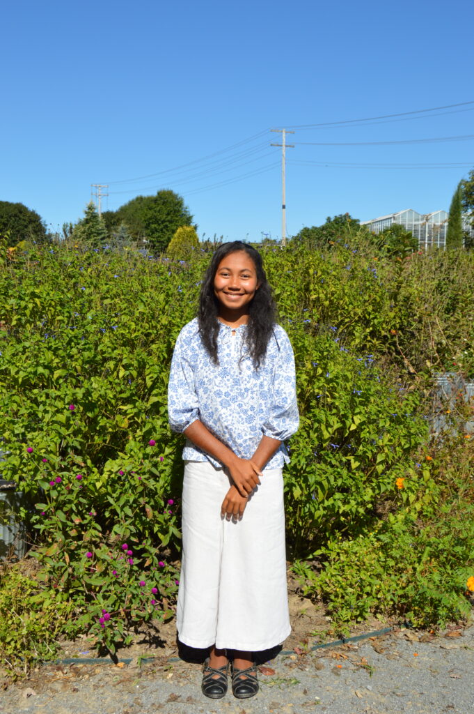 Student outside in the garden