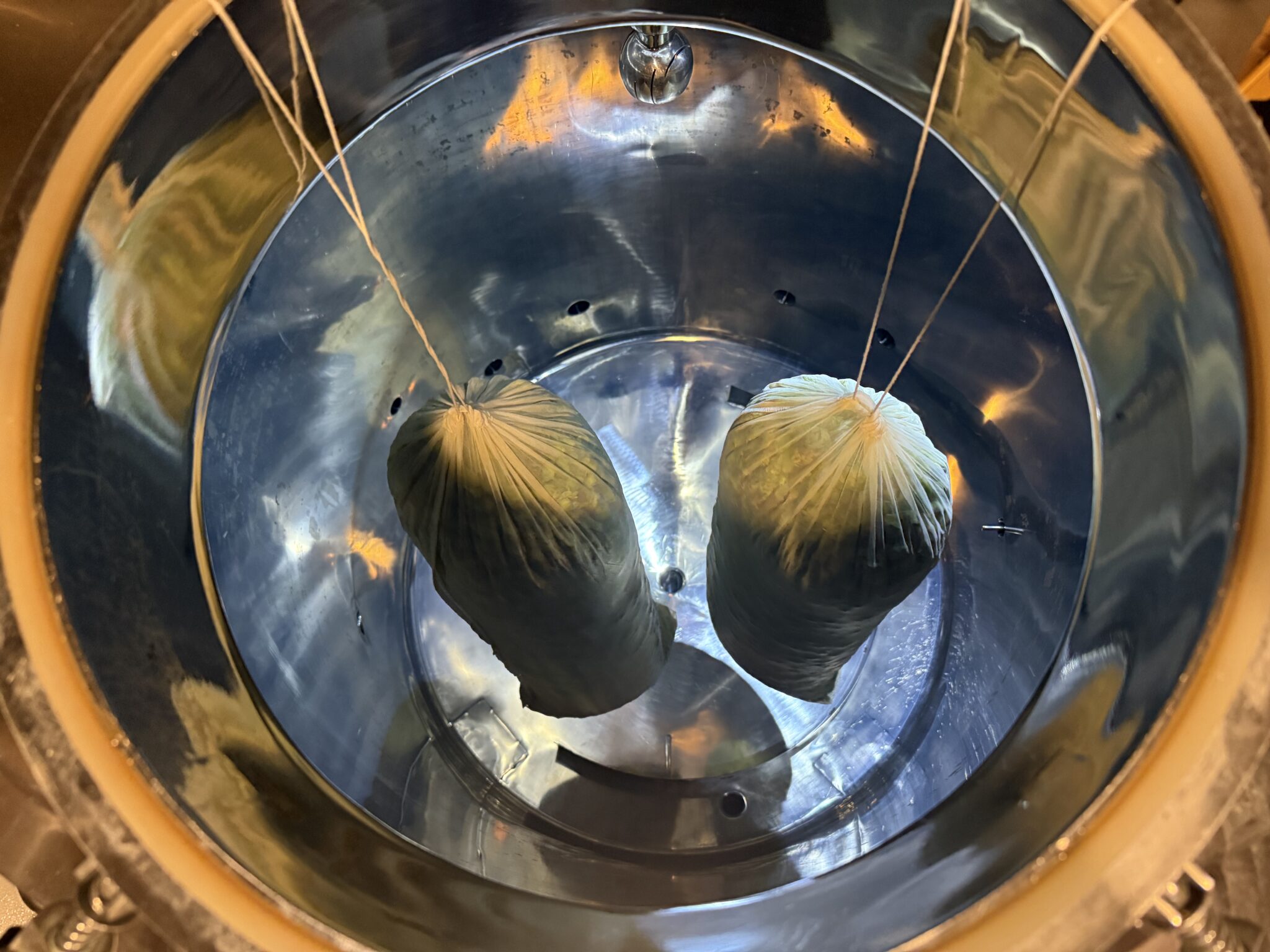 Bags of hops being brewed