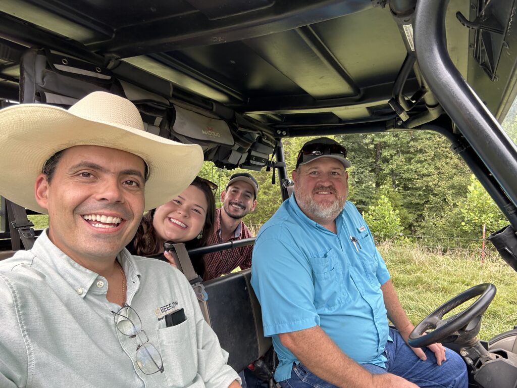 People smiling in a golf cart