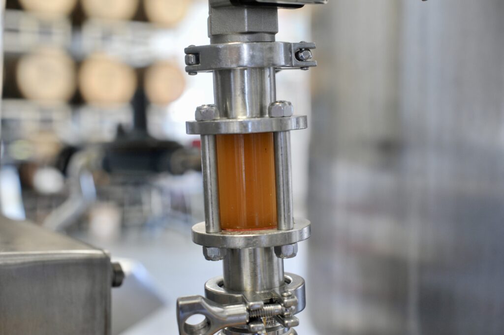 Photo of amber liquid in a machine