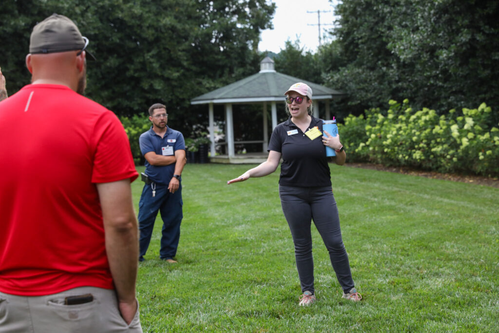 Woman speaking to a group outside