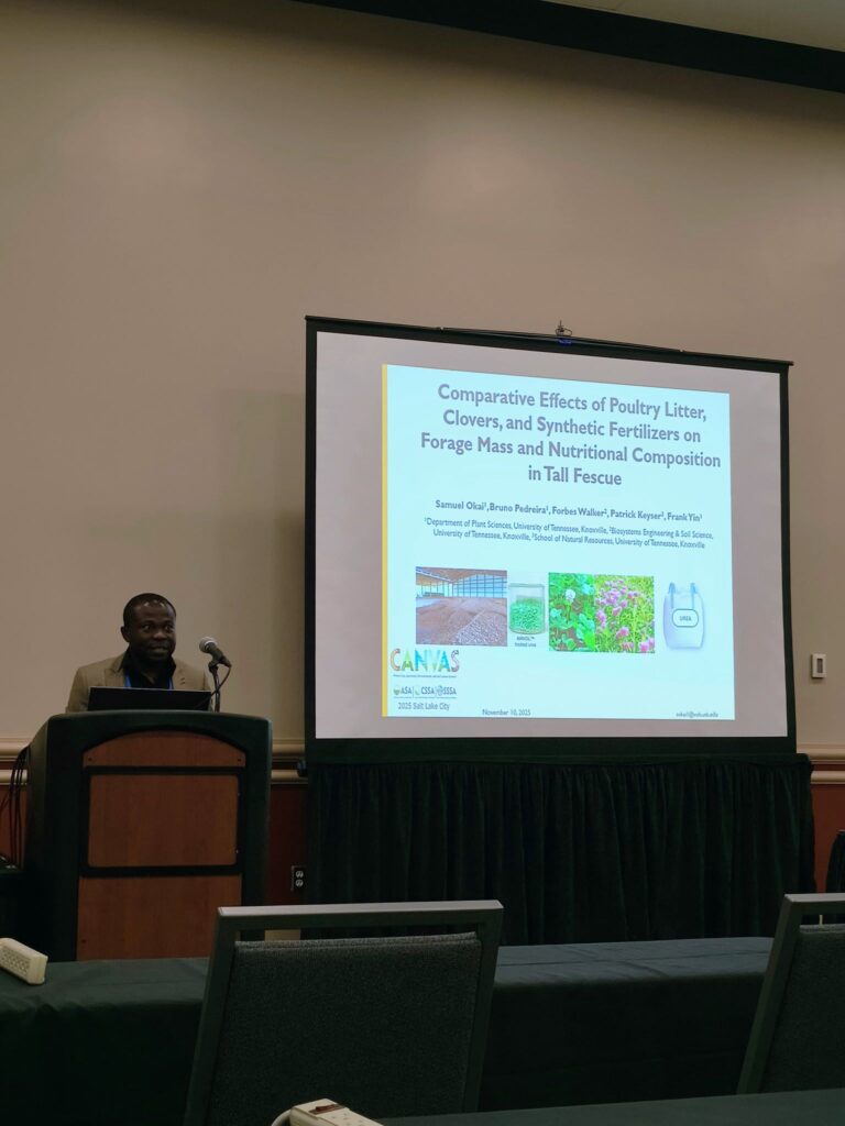 Photo of a man presenting in front of a screen