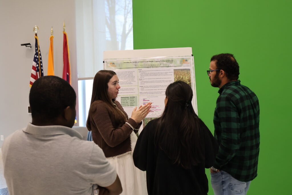 People watching someone present a poster
