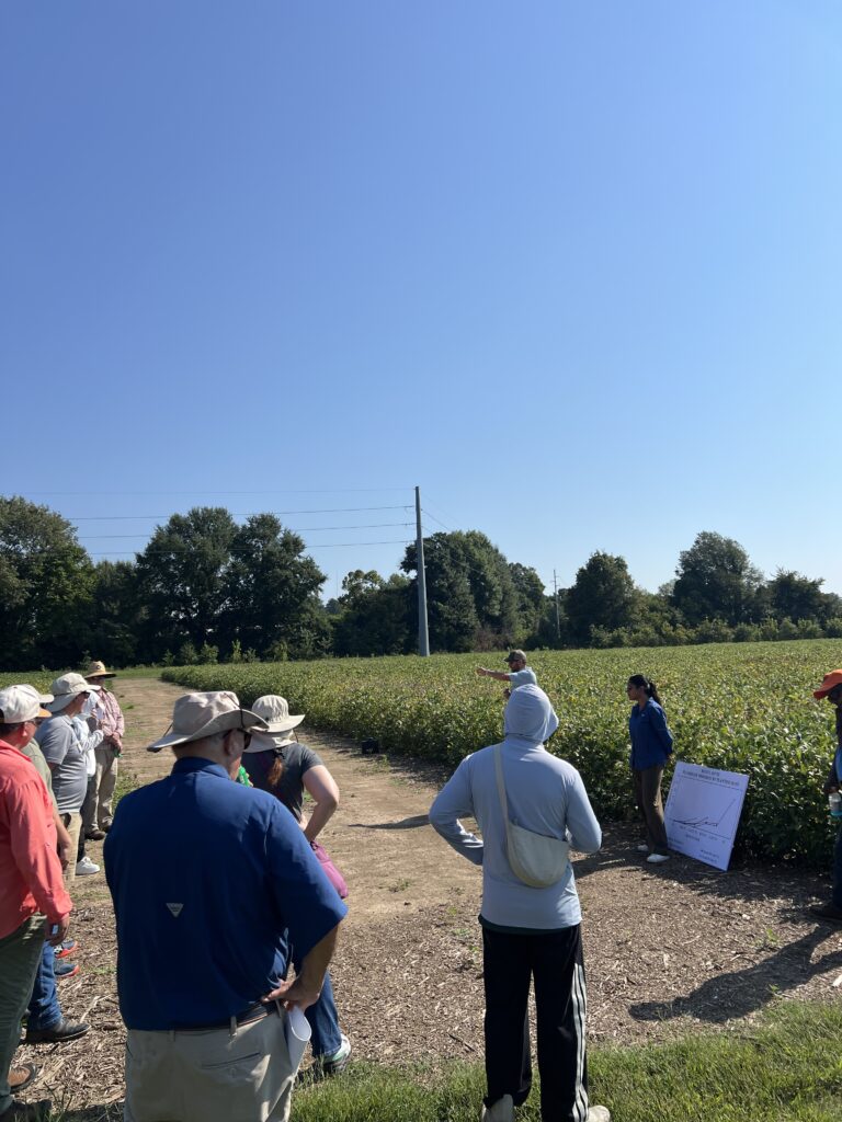 People at a farm listening to a speaker